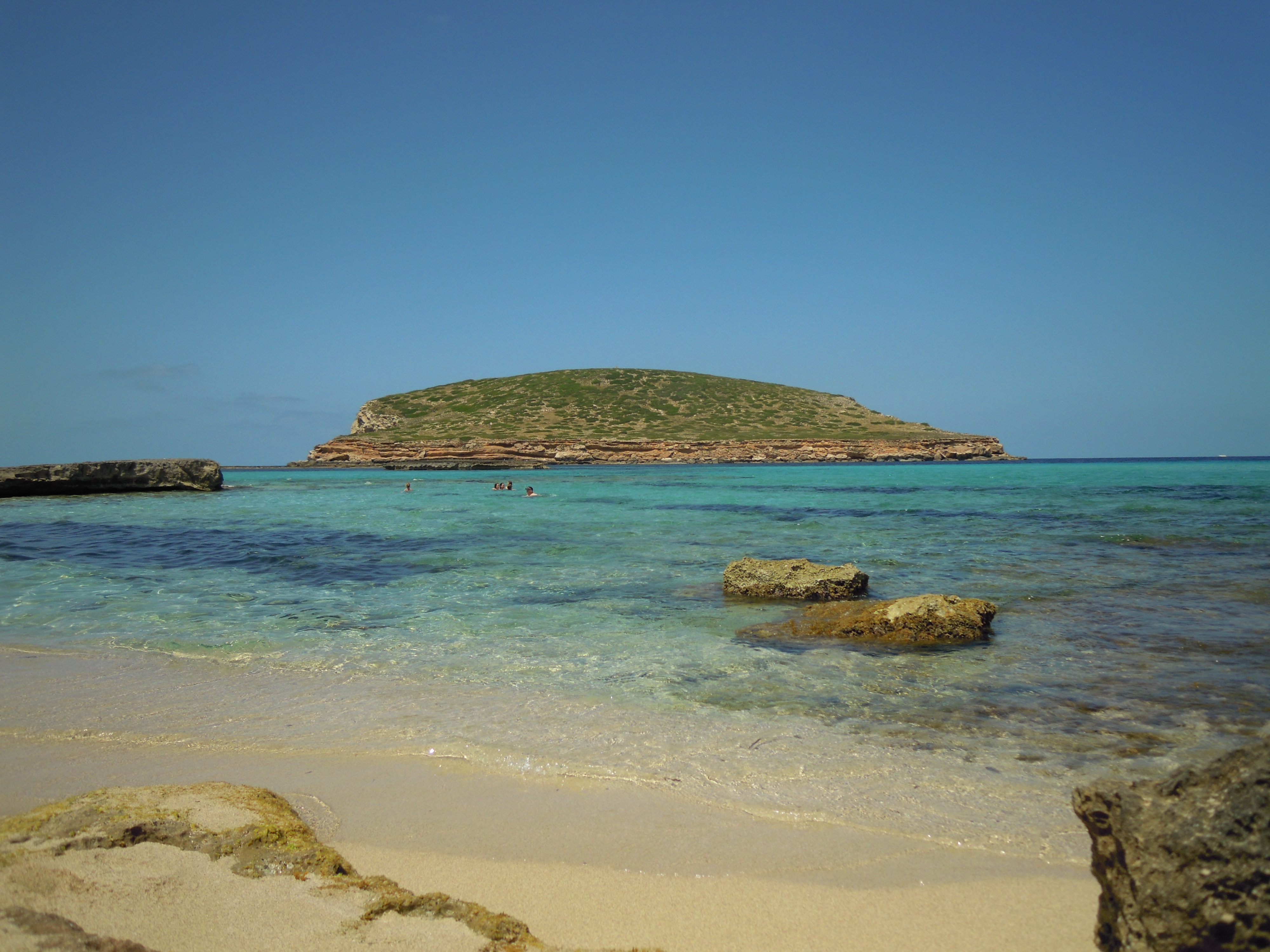 Clear turquoise cove on the Ibiza coastline